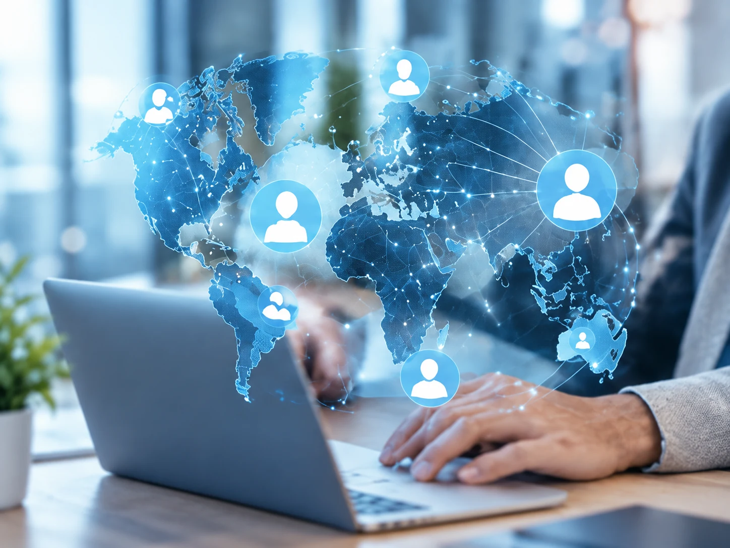 A blue world map with connected user icons above a laptop, illustrating a global digital services network